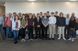 A group of Information Science and Technology Students smile for a photo.